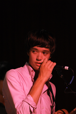 Chris Chu, lead singer/guitarist of The Morning Benders, checks in with keyboardist/guitarist Joe Ferrell in between songs.