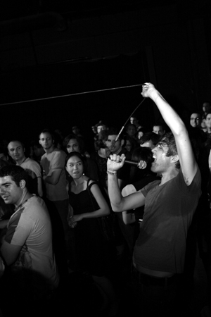Singer Keith Murray yanks his mic cord as far as it'll go into the crowd, making it almost all the way to the divider between all ages and 21+.