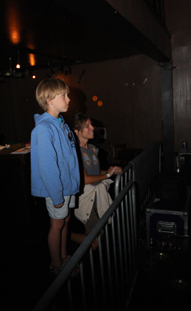 The night's youngest audience member watches from stage right. This little guy probably has one of the coolest moms in Seattle, and though the photo was snapped after midnight aE” past his bedtime, I'd assume aE” he wasn't going anywhere.