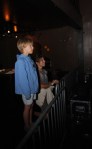 The night's youngest audience member watches from stage right. This little guy probably has one of the coolest moms in Seattle, and though the photo was snapped after midnight aE” past his bedtime, I'd assume aE” he wasn't going anywhere.