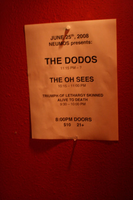 The NEUMOS presents: set list hangs tacked to the wall, printed on plain paper.