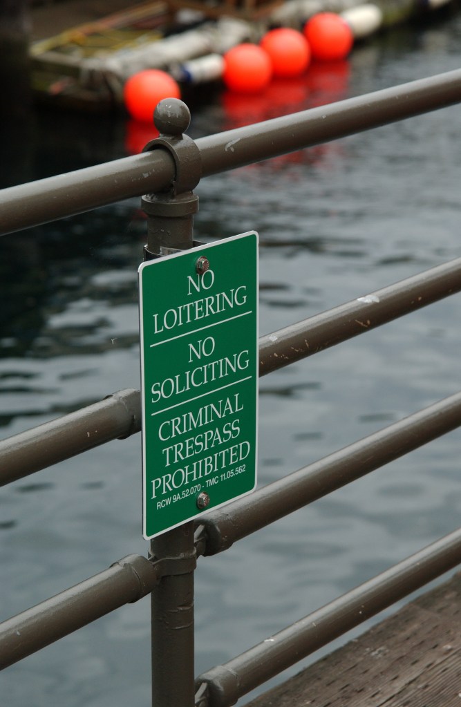 While it is hard to find many waterfront signs indicating access, there are plenty encouraging you not to linger. Here is one example, near Ivar's.