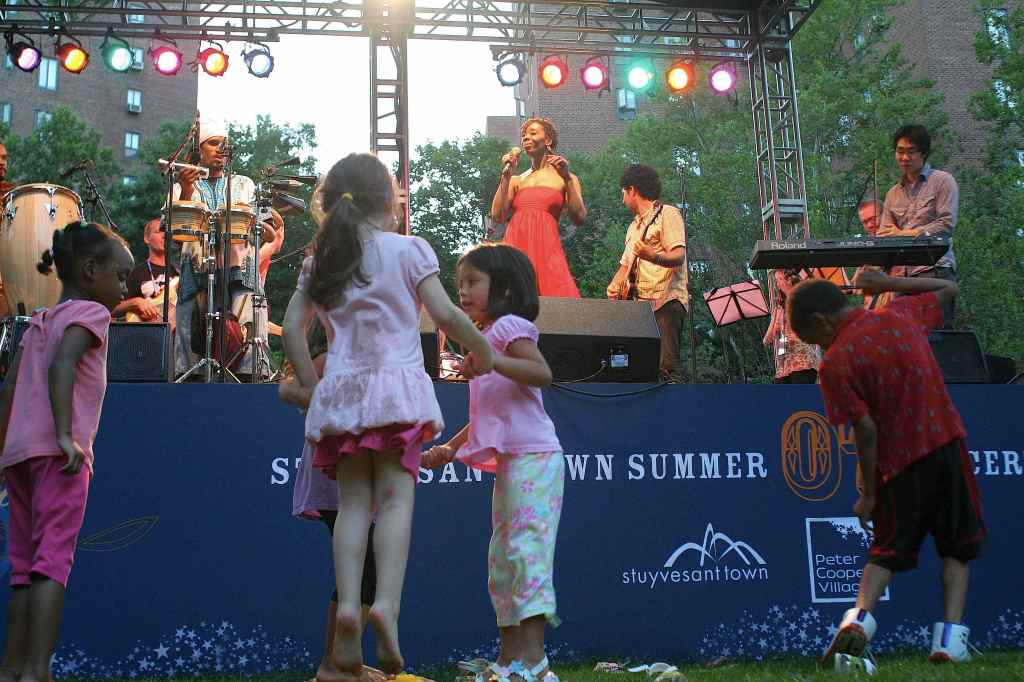 Escort; Stuyvesant Town Oval, New York City, NY; July 25 I hate nightclubs. Cramped, dingy, sweaty, vodka-soaked dungeons so poorly lit I canaE™t read between sets. Just total bullshit. So the ideal concert environment is outdoors, spacious, a hint of breezeaE”plus a wide age range and easy access to lemonade and/or chocolate-chip cookies. EscortaE™s Wednesday-night gig in the luscious common ground of a Manhattan apartment complex satisfied all these requirements, an exhilarating burst of live big-band disco (theyaE™re behind the aEœAll Through the NightaE video, the one with all the Muppets) enthusiastically received by a bunch of dancing little kids with balloons. Not to mention the odd septagenarian. aEœIf they can bring this out in meaE”a 78-year-old lady!aE hooted a nearby dancing queen. aEœI havenaE™t felt this good in ages!aE It was a real Billy Madison sort of moment. Pass the lemonade, dear. (Rob Harvilla)