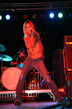 Iggy Pop; The beach (literally) at Collins Ave. and 21st Street, Miami Beach, FL.; December 7The annual winter, Miami Beach edition of the hoity-toity international Art Basel art fair is, in a word, a clusterfuck of celebrity, money, and, oh, art. And a little music. The highlight of each year is the fairaE™s opening-night aEœArt Loves MusicaE event, with a free concert on the sand by someone suitably provocative. (Past years have featured performances by Peaches, the New York Dolls, and Scissor Sisters). This year, though, was possibly the best yet aE“ a set by adopted hometown guy Iggy Pop, and all of the remaining Stooges. The crowd was an amazing mashup of aging rockers, little punk kids, rich collectors trying to be down, and straight-up drunks peeing in the nearby dunes. Iggy was properly shirtless, writhing, and berserk, and an adoring mob rushed the stage, making it look as though aEœNo FunaE were performed by a gigantic sweaty, pink centipede. aE”Arielle Castillo