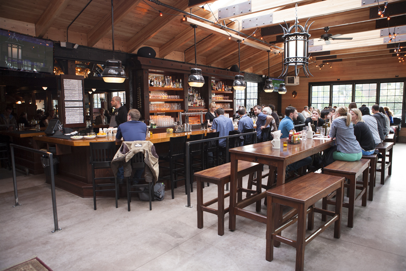 Built to cruise-ship scale, Von Trapp’s features three bars, two floors and one fireplace nook furnished with an elk head, hanging gothic light fixtures and Breugelesque wooden tables and benches.