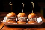 The lamb sliders, perched on grilled brioche buns and smeared with a tart horseradish aioli, are wonderfully juicy.