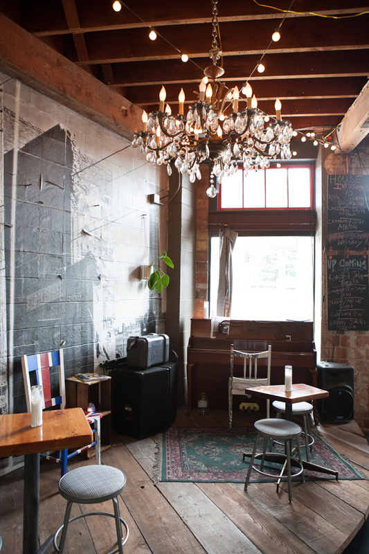 As expected, the ceiling rafters are exposed and most of the light bulbs are bare.