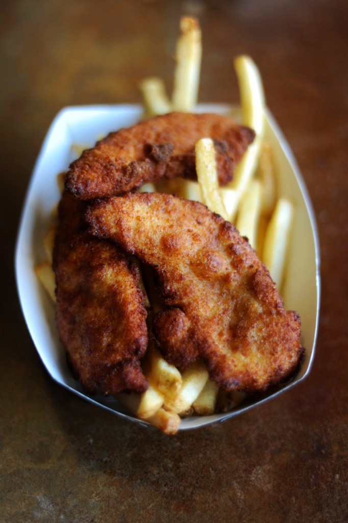 Portobello steamed buns from The Natural, top left; chicken tenders from Hamburg & Frites, above; the inevitable vegan chili-cheese dog from Field Roast, left.