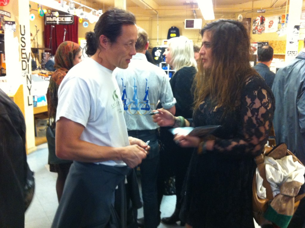 Lace-clad Rabia Qazi chatting with a fan.