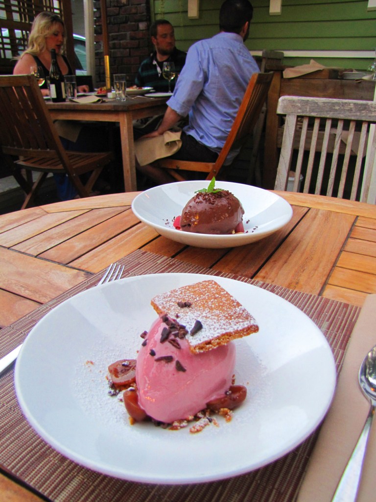 Front: cherry frozen yogurt, Graham cracker, compressed cherry, cacao nib at Tilth. Background: chocolate hazelnut sorbet with Theo dark chocolate, rhubarb, lavender mint.