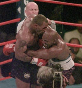 Mike Tyson bites into the ear of Evander Holyfield in the third round of their WBA Heavyweight match Saturday, June 28, 1997, at the MGM Grand in Las Vegas.  (AP Photo/Jack Smith)