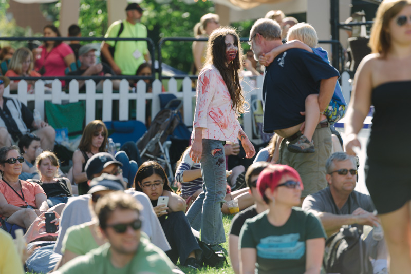 A zombie scoped out dinner while wandering through the grass of the Starbucks Stage.