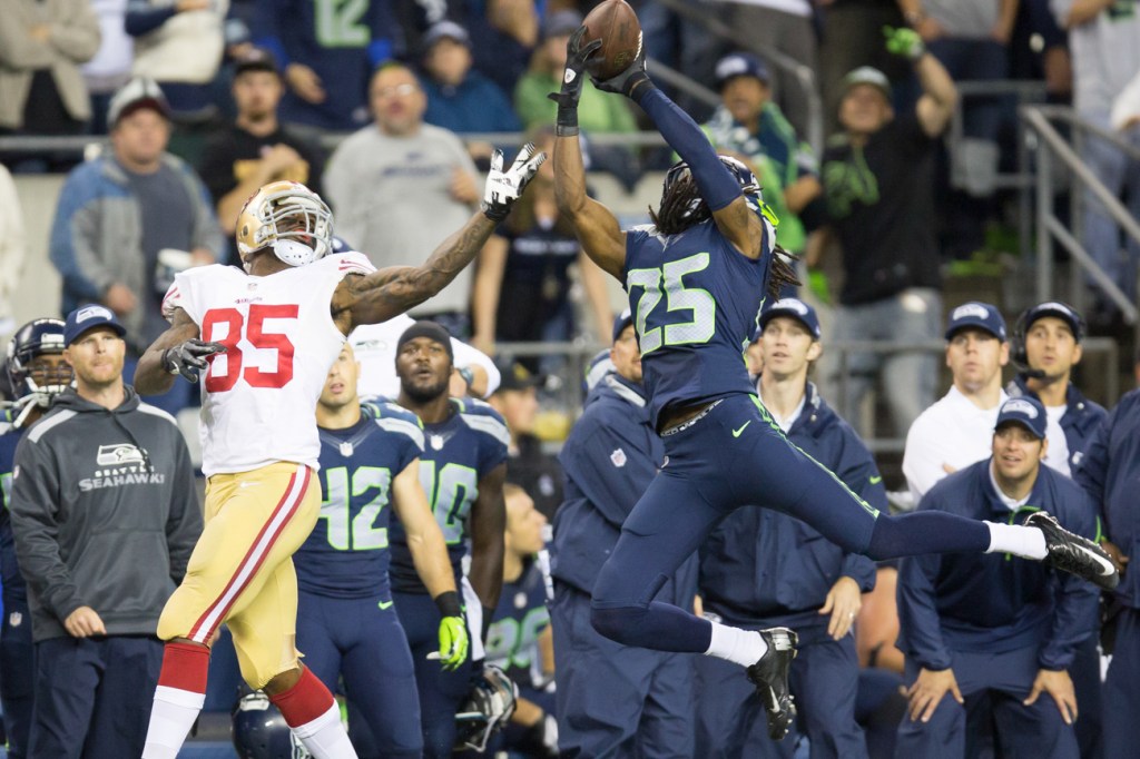 Hawks cornerback Richard Sherman picks off 49ers QB Colin Kaepernick.