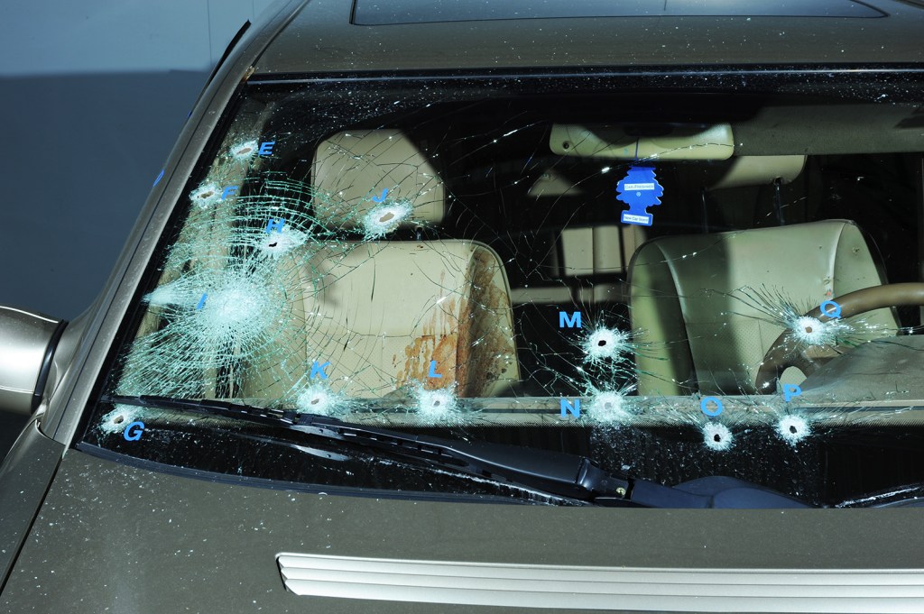 Three Bellevue officers fired 21 rounds at Smith. Below: Russell Smith, left, and his brother Rydell were the targets of the raid.