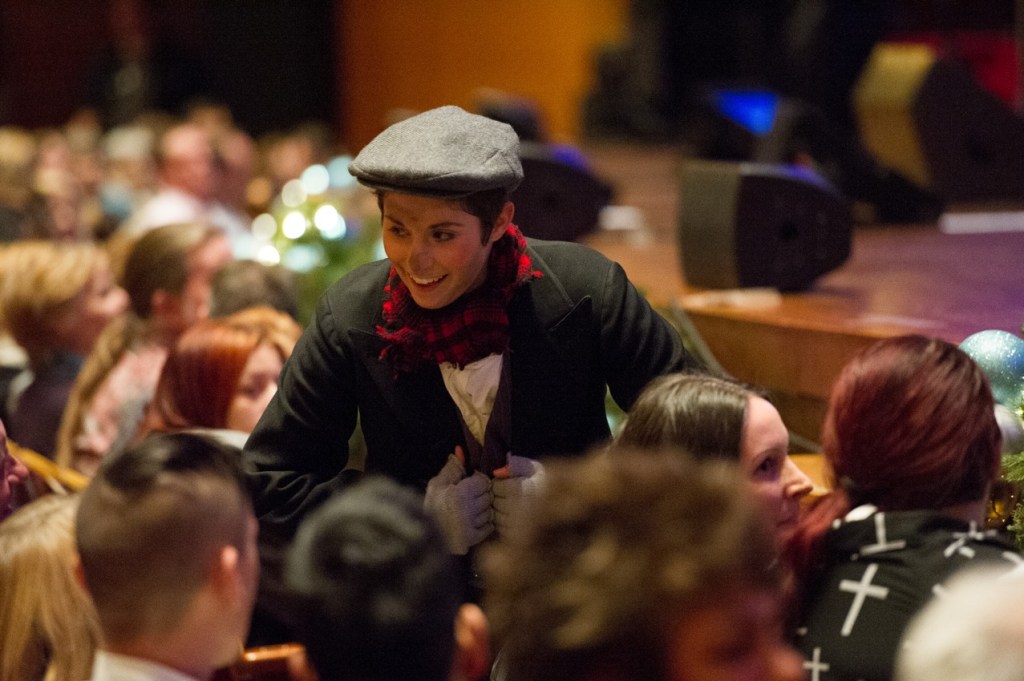 A cast member from 5th Avenue Theatre's production of Oliver! works the crowd.