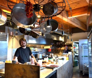 Ronspies in his cozy kitchen at Le Petit Cochon.