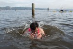 For the privilege of running headlong into freezing cold water, dunking their heads under it...