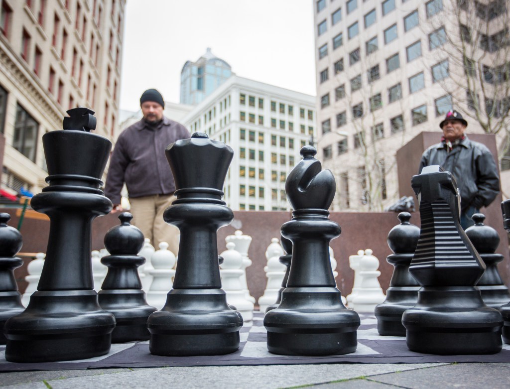 Calin Teodoru (left) contemplates his next move during a chess match held in Westlake Park. Photo by Joshua Bessex