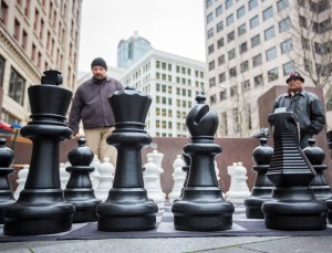 Calin Teodoru (left) contemplates his next move during a chess match held in Westlake Park. Photo by Joshua Bessex