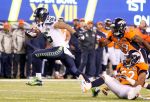 Jennifer Buchanan / The Herald Seahawks wide receiver Jermaine Kearse breaks a tackle by Broncos linebacker Wesley Woodyard to score a touchdown during the third quarter of Super Bowl XLVIII at MetLife Stadium.Photo taken 020214Sports - Super Bowl XLVIII- Seattle Seahawks vs. Denver Broncos
