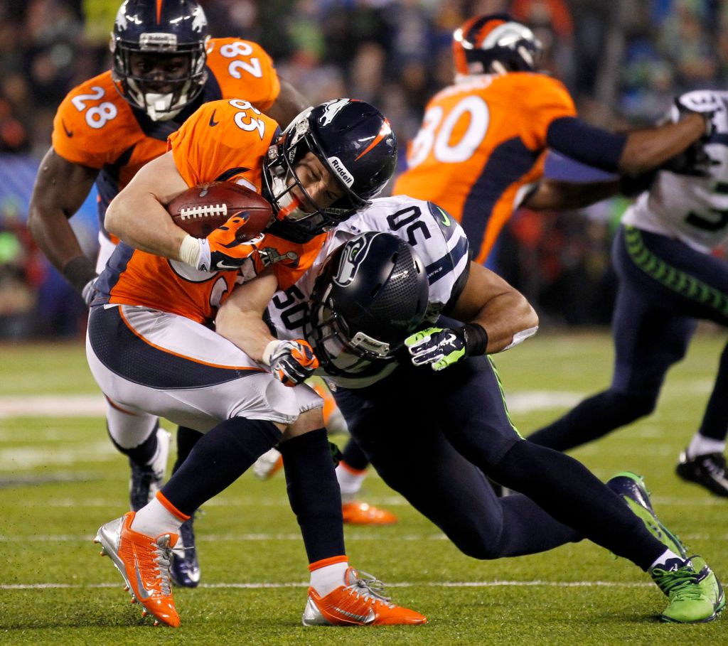 Seattle’s Super Bowl shellacking of the Denver Broncos portended future greatness for the very young team. University of Washington alumnus Jermaine Kearse, left, bounced off Denver’s defense with the youthful aplomb afforded 23-year-olds. K.J. Wright, above left, crushed the comparatively elderly Wes Welker. Zach Miller attempted to forge a connection with Kearse and Derrick Coleman, above right, despite the fact that, unlike his younger teammates, the 28-year-old tight end was alive during the Reagan administration. And 25-year-old Russell Wilson, top, hoisted his first Lombardi Trophy.