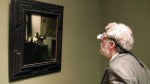 Jenison inspects Vermeeris Woman With a Lute at the Met.Shane F. Kelly/High Delft Pictures