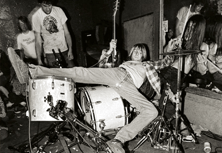 Kurt Cobain with his band in 1990. Photo by Charles Peterson
