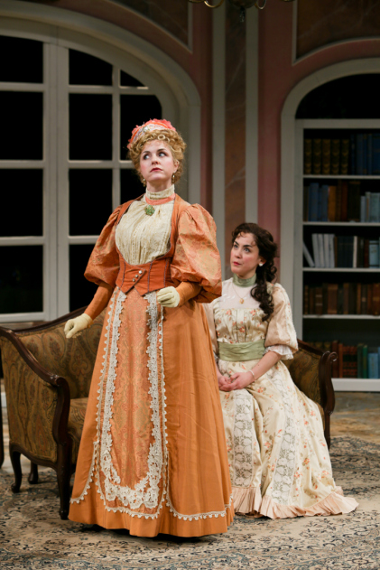 A harsh confrontation between Gwendolen and Cecily (Grogan and Lass).