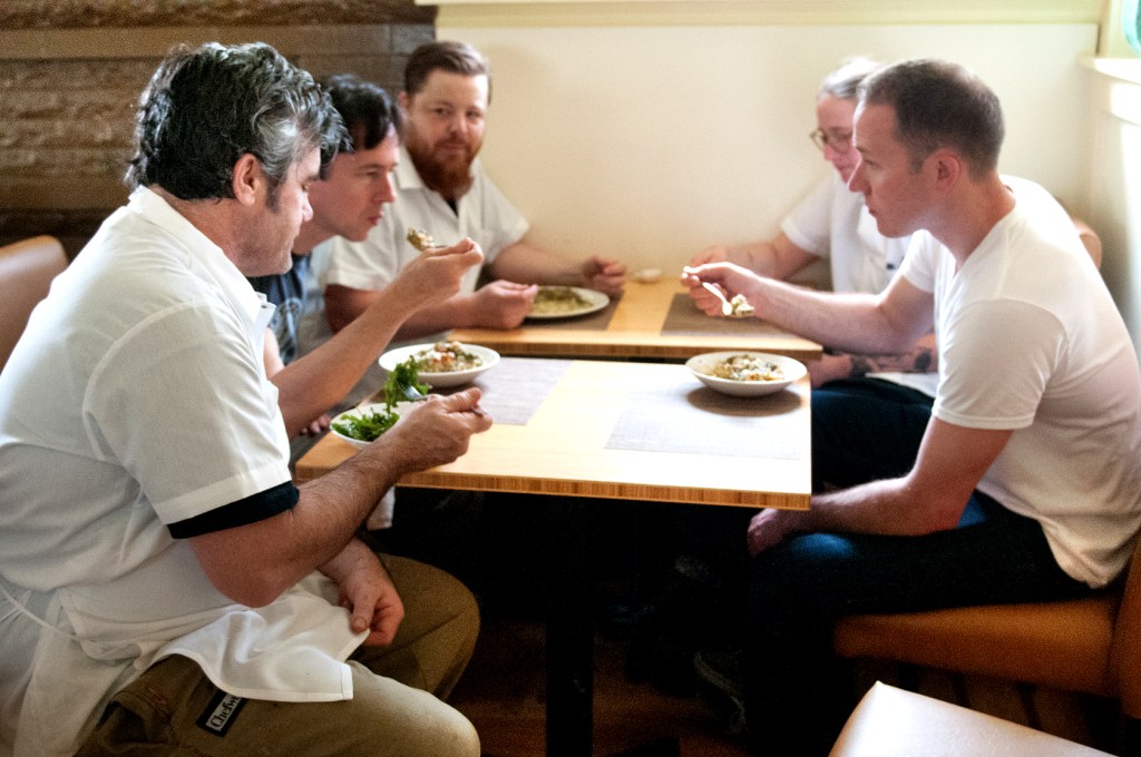 The Tilth crew breaks bread before a busy night.