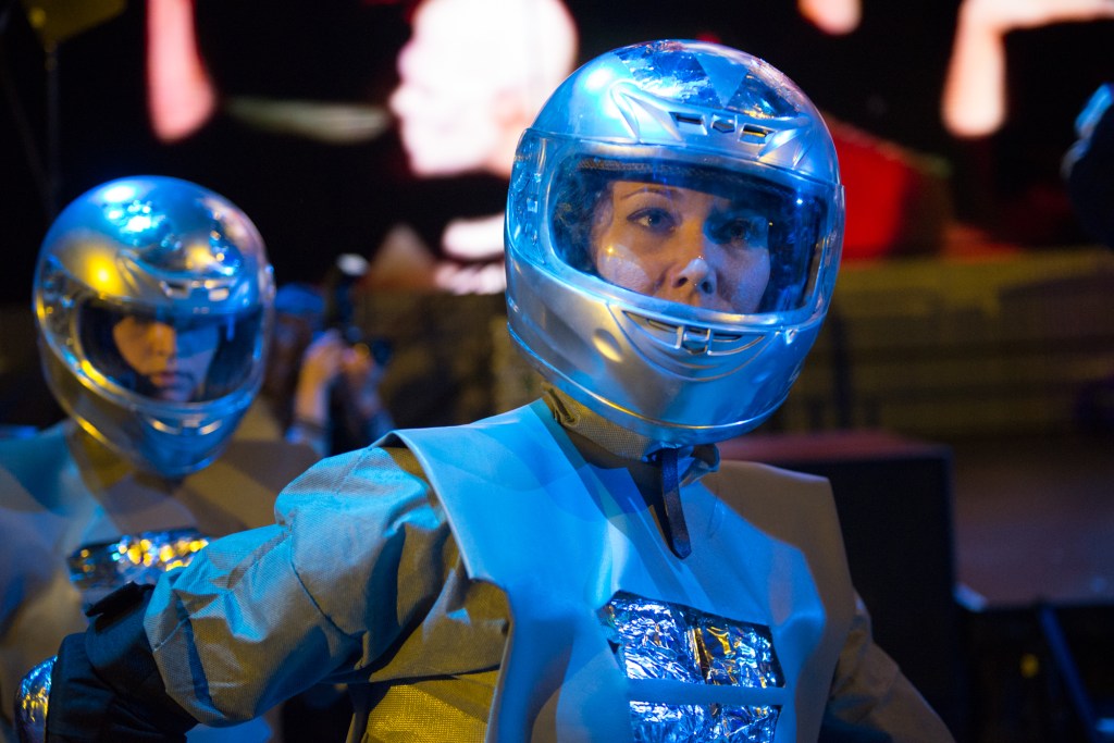 The motorcycle helmet is a pretty close proximity to the real outfits to the "Around the World" video. I bet it was pretty hot in there.