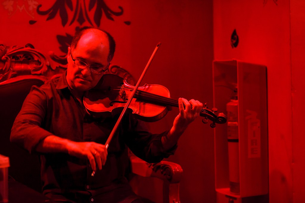 Mikhail Shmidt warms up for the Poisson Rouge performance.