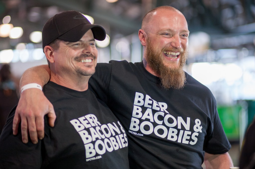 Attendees pose for a photo during Saturday's Bacon and Beer Classic.