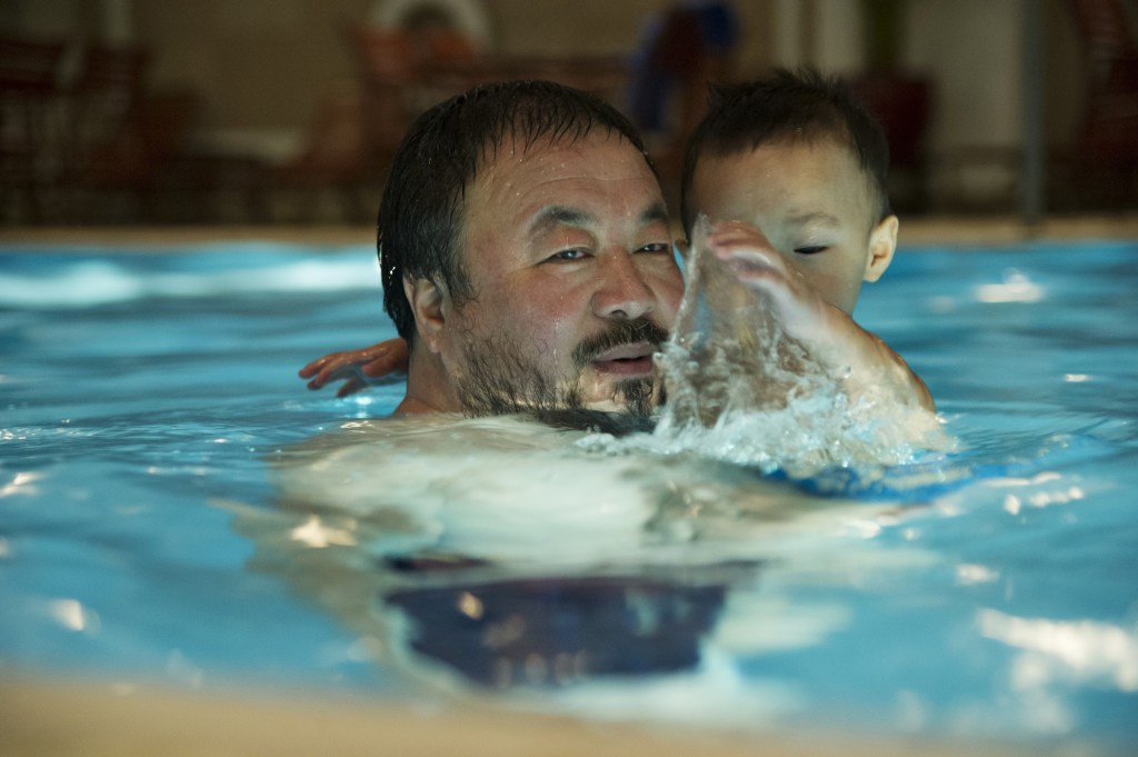 Ai (with his son) was understandably glad to get out of jail.