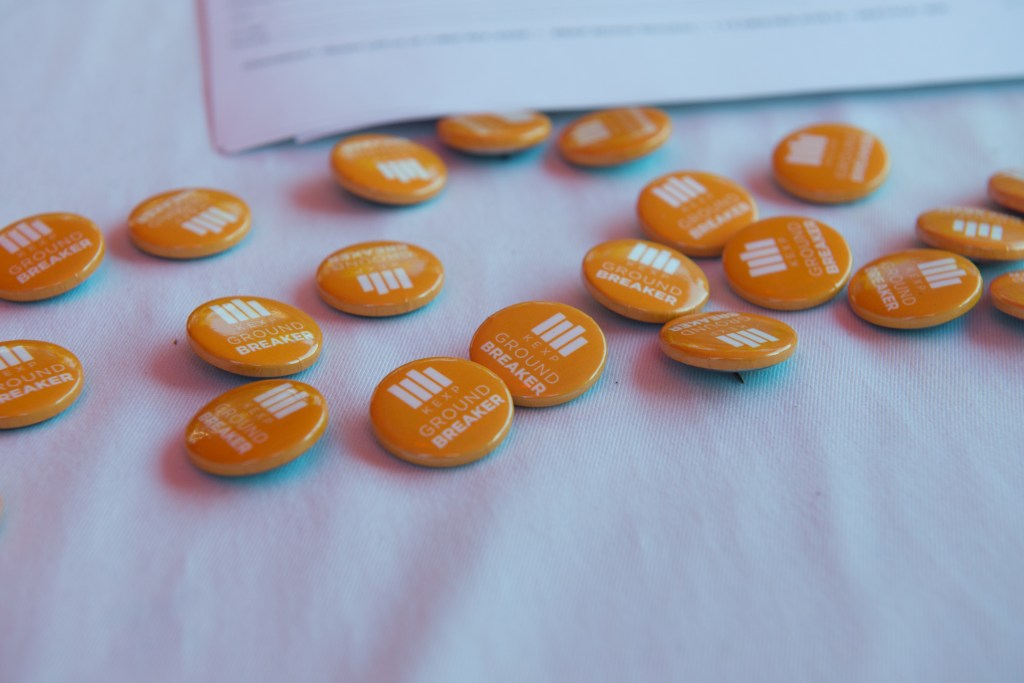 Ground Breaking buttons were handed out at the event