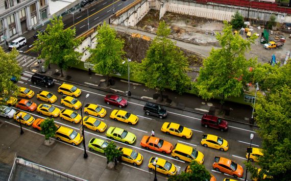 Drivers line the streets in front of City Hall in protest last summer. Photo by Tegra Nuess
