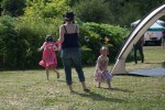 Little ones play with bubbles as the music plays on nearby.