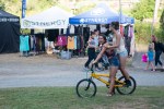 Bikers making their way around the Timber Fest grounds.