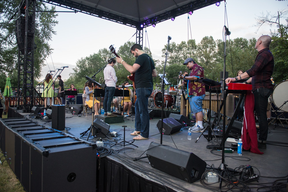 Seattle Rock Orchestra took the stage with so many members they barely fit on the stage; more musicians to better to rock out.