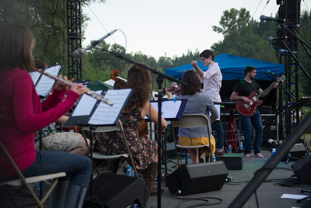 Seattle Rock Orchestra took the stage with so many members they barely fit on the stage; more musicians to better to rock out.