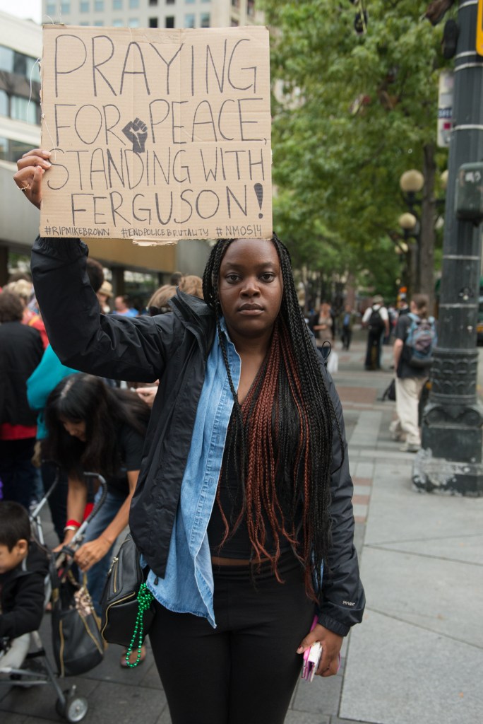 Attendee at the silent vigil in support of the goings on in Ferguson, MO. Photo by Morgen Schuler