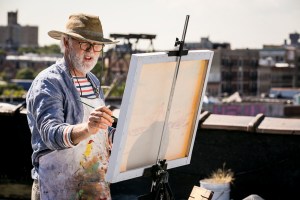 Ben (Lithgow) at the easel.