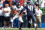 Seattle's Byron Maxwell prepares to tackle Denver's Emmanuel Sanders in the first quarter.