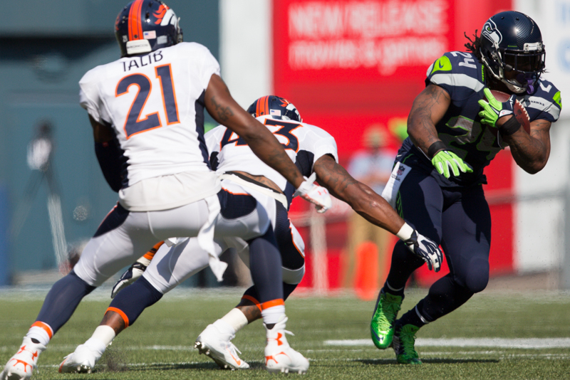 Marshawn Lynch breaks a tackle for a gain in the second quarter.