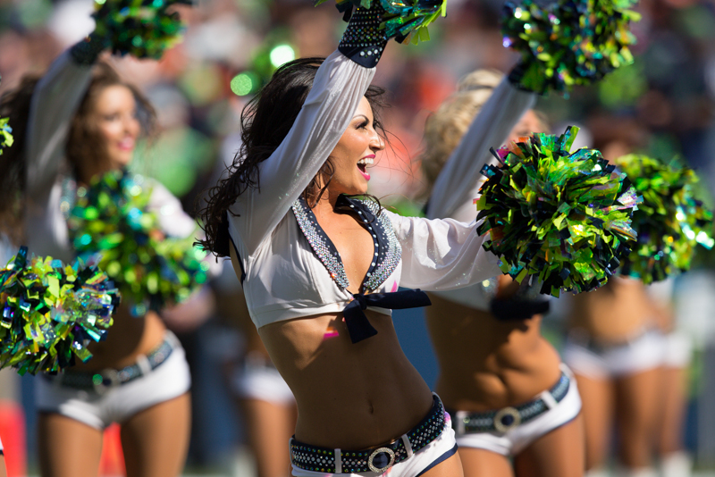 The SeaGals dance on field.