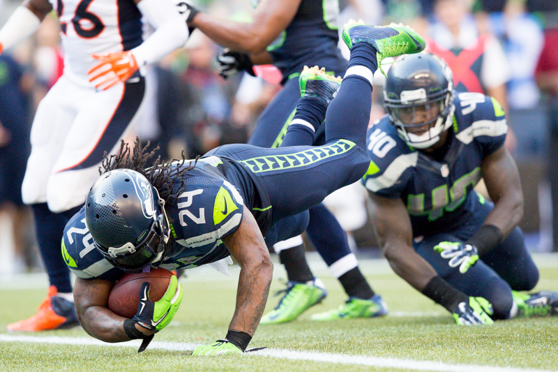 Marshawn Lynch makes his game-winning dive in overtime to beat Denver 26-20.