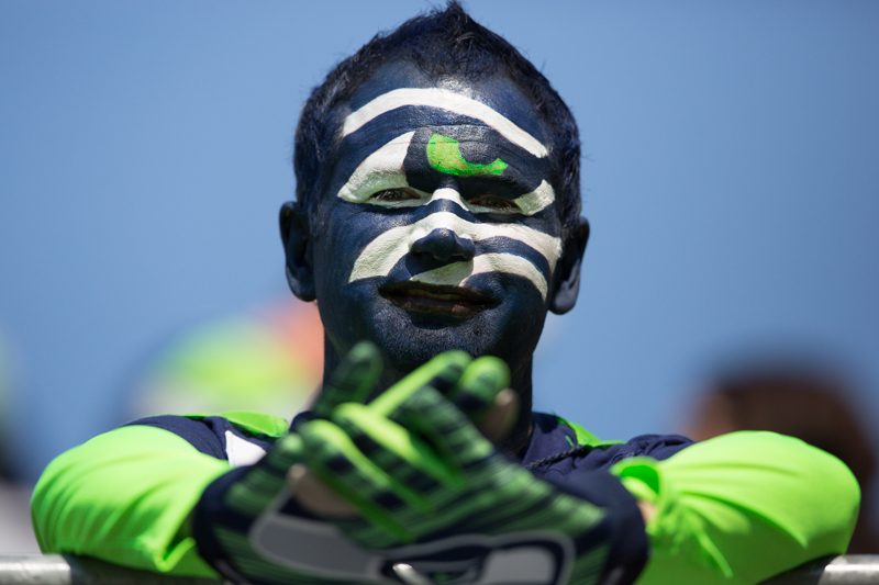 A fan poses for a photo before the game.