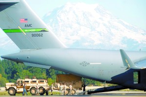Life during wartime: A C-17 is loaded at JBLM in 2011.