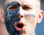 A Dallas fan cheers during the game.