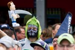 A Seattle fan, quasi-mimicking the grim reaper, holds up an impaled Tony Romo doll. Photo by Jeremy Dwyer-Lindgren