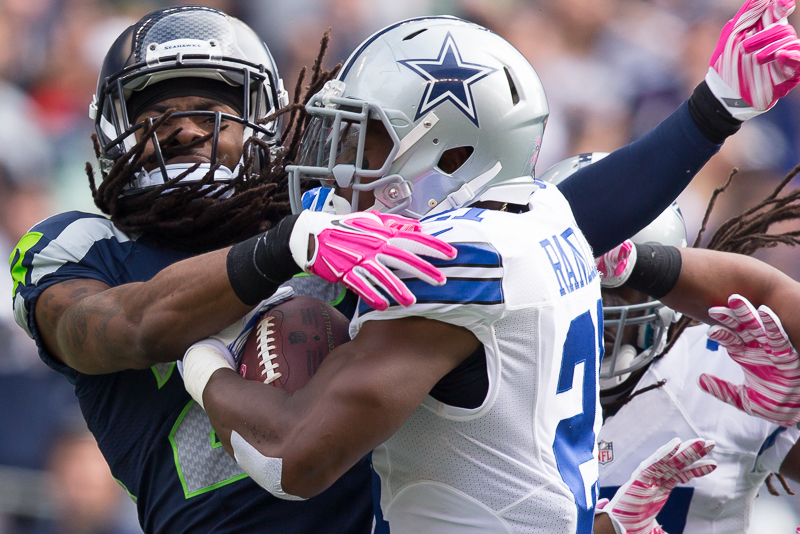 Seattle cornerback Richard Sherman attempts to end a 38 yard run by Dallas' J. Randle.